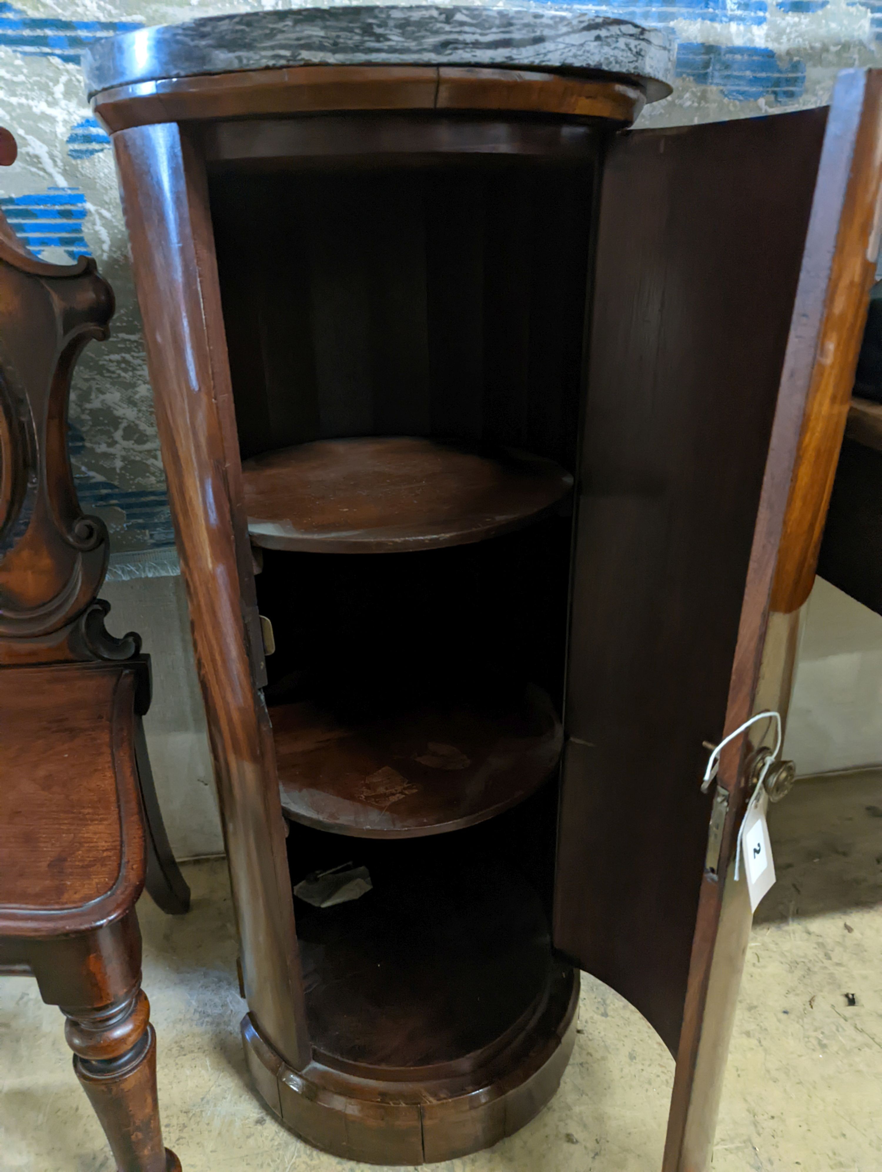 A Victorian mahogany marble topped cylindrical pot cupboard, diameter 40cm, height 92cm